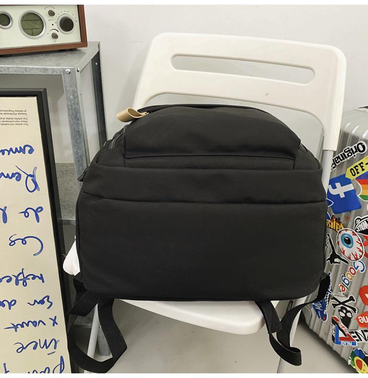 Fashionable Water-Repellent Student Backpack: Trendy High-Capacity Design for Couples