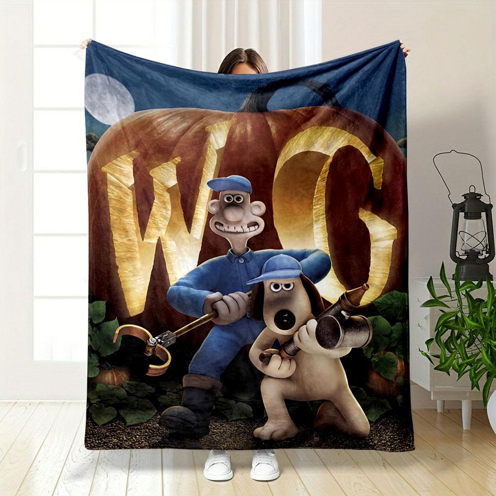 A Large Pumpkin Carved with "W G" and Two Characters In Front of It. for All Seasons Blanket Lunch Break Throw Gift