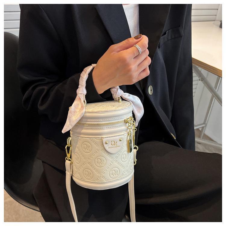 Autumn 2024 Trendy Women's Round Bucket Crossbody Bag: Solid Color, Textured, Hand-Held, and Stylish.