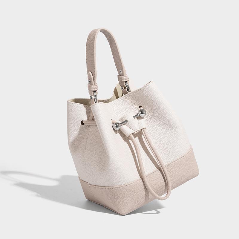 Нишевый дизайн Ретро сумка-ведро на кулиске для женщин 2025 Лето Новая Высококлассная ручная сумка через плечо для женщин