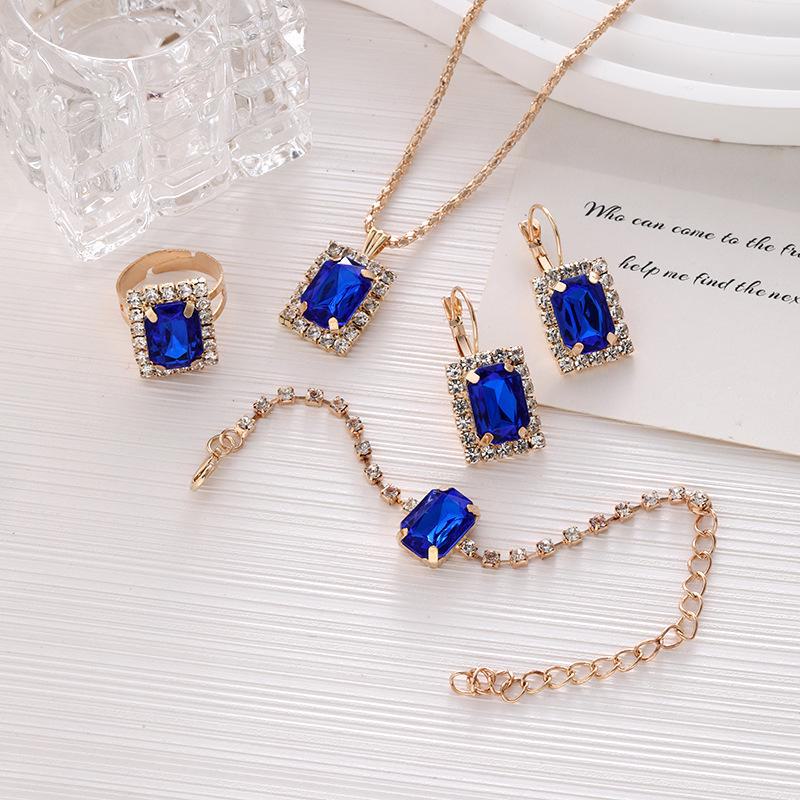 Women's Rhinestone Jewelry Set: Geometric Necklace, Ring, Bracelet & Earrings - 4-Piece Bridal Collection
