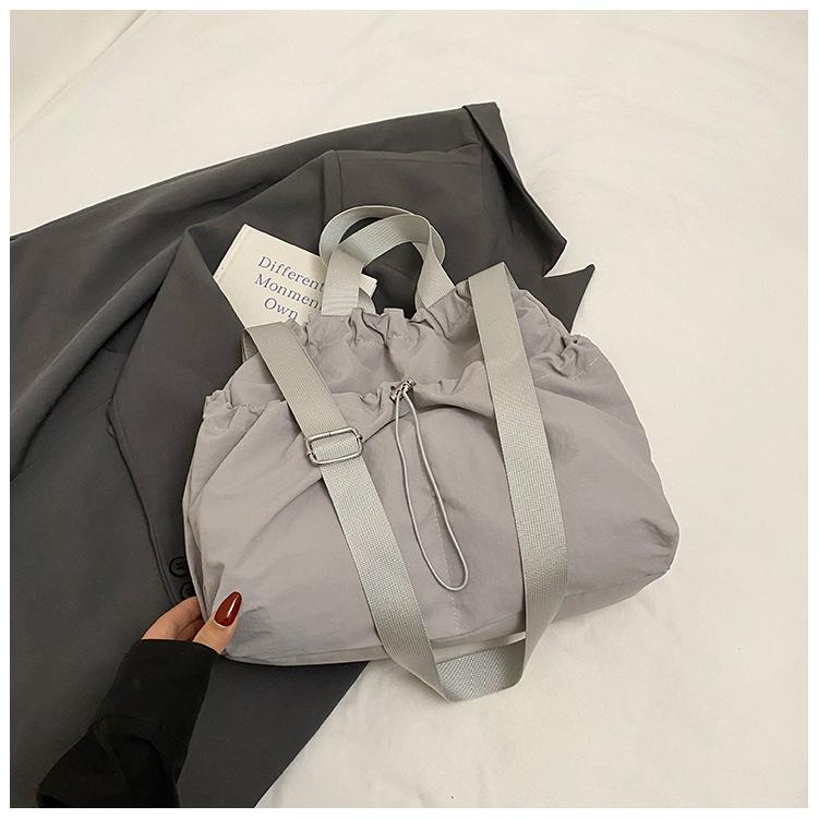 2025 Japanese Hansen Lazy Wind Canvas Bag Women's Large Capacity Drawstring Handbag High Value College Student Class Bag