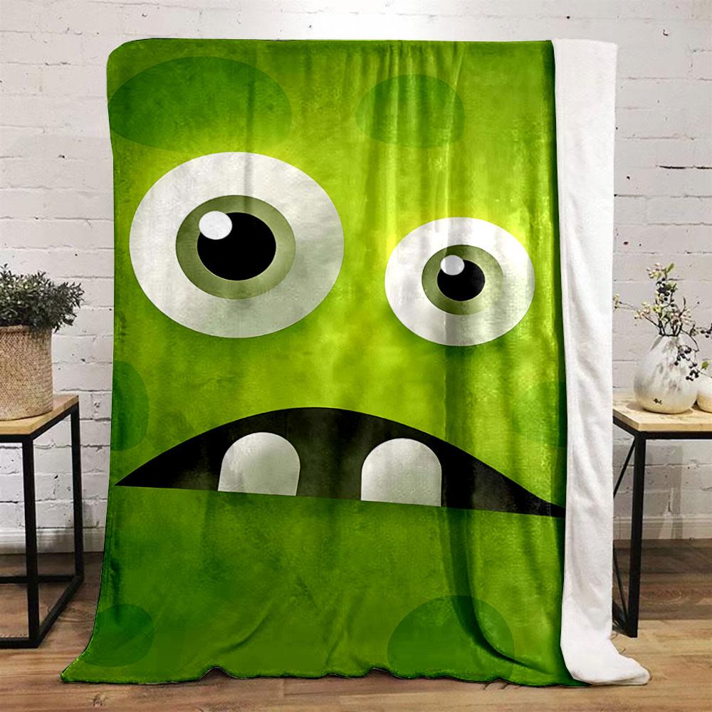 Large cartoon eyes, a dark mouth, teeth, and green textured background. for all seasons blanket lunch break throw gift