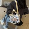 2025 модная персонализированная холщовая сумка через плечо, трендовая, большой вместимости, с мультяшным принтом в виде букв, женская популярная универсальная сумка-мессенджер