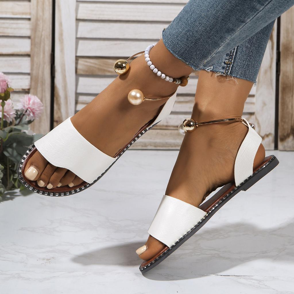European and American one-word buckle flat sandals women's new open-toed simple pearl metal buckle cool slippers