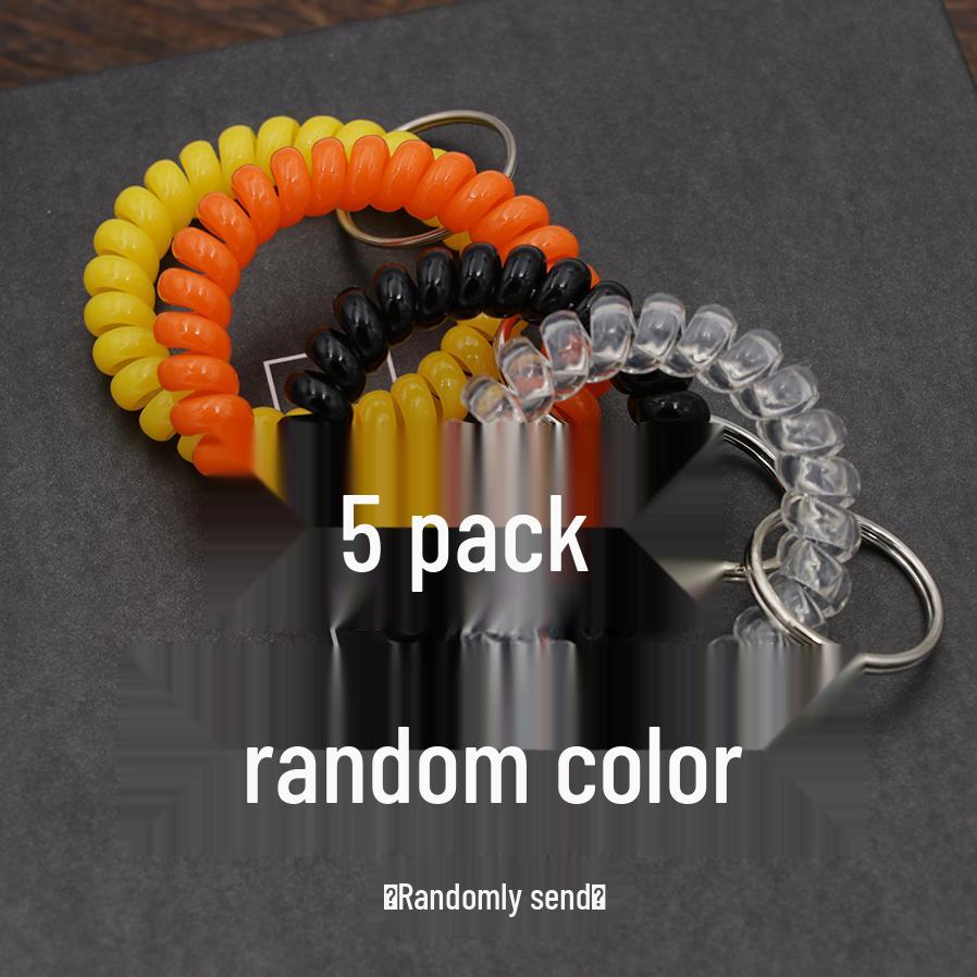 Минималистичный браслет-брелок и резинка для волос в виде пружинного механизма