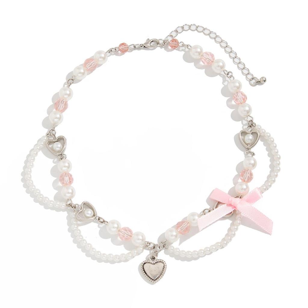 Ожерелье с кулоном из клубничного жемчуга и лентой-бантом в милом стиле.