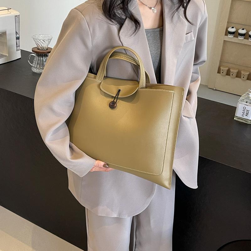 Сумка женская большой вместимости 2025 новая модная с ощущением высокого класса зарубежная универсальная ручная сумка популярная портативная сумка-тоут для компьютера