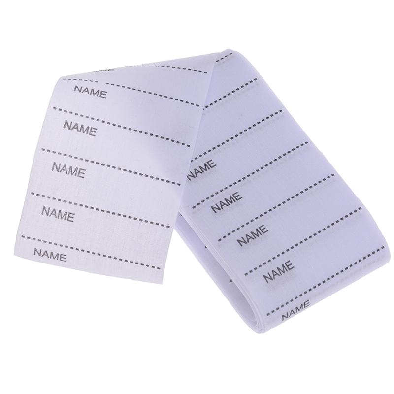 Белый моющийся утюг на наборе маркеров бирок ткани одежды ярлыков имени для одежды