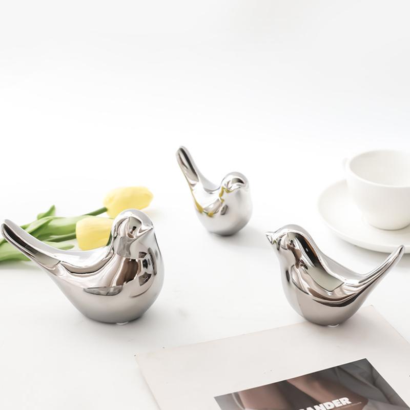 Серебряные керамические украшения в виде птиц. Роскошные простые керамические фигурки птиц. Золотые керамические фигурки птиц.