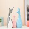Home Décor Happy Deer Family Matte Finish Ceramic Figures (Set of 4, Sky, Brown, Pink, Off-White)