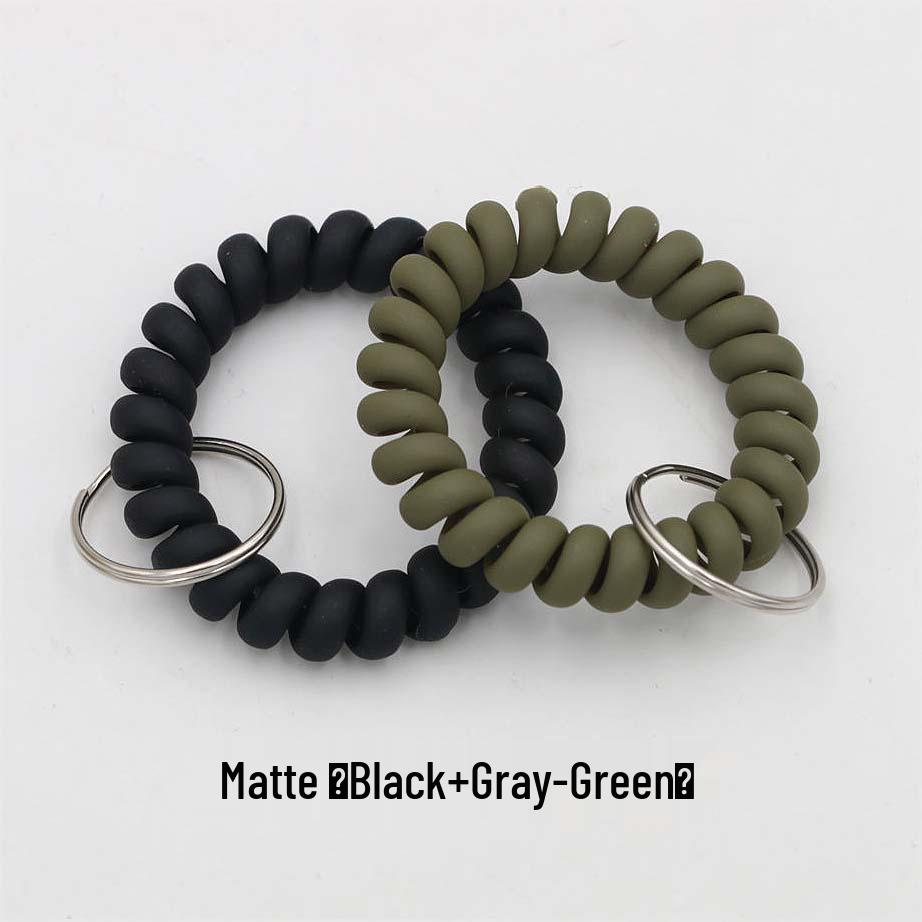Минималистичный браслет-брелок и резинка для волос в виде пружинного механизма