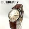 Б/у Рабочее состояние Новая батарея заменена Часы BURBERRY Burberry Nova Check Аналоговые Дата Золотой циферблат 3 стрелки Кварцевый Ремешок под крокодила Кожаный ремешок Коричневый