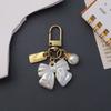 Милый брелок с жемчужным цветком, блестящий лист ракушки, брелок для ключей, металлическая бирка, подвеска, аксессуары для женщин, автомобильная безделушка, шармы для сумки, ювелирные изделия