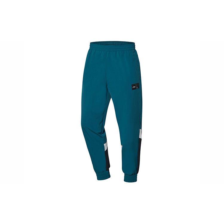Li Ning Повседневные спортивные длинные брюки зауженные плетеные мужские низ Deep-Spruce-Green AYKQ053-2