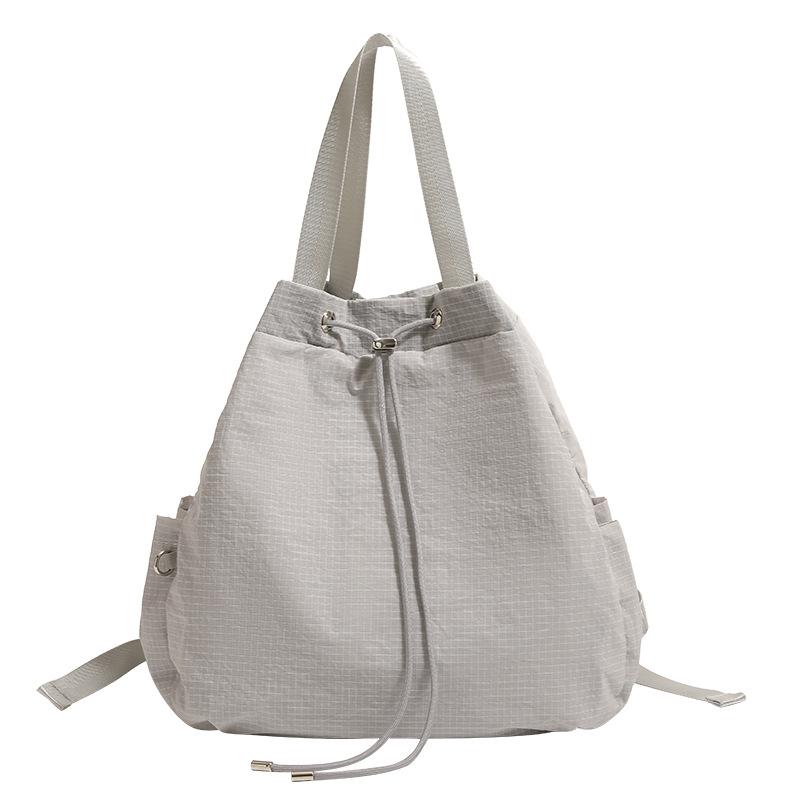 Simple, lightweight, casual nylon drawstring bucket bag, large-capacity backpack, women's commuter shoulder and crossbody bag