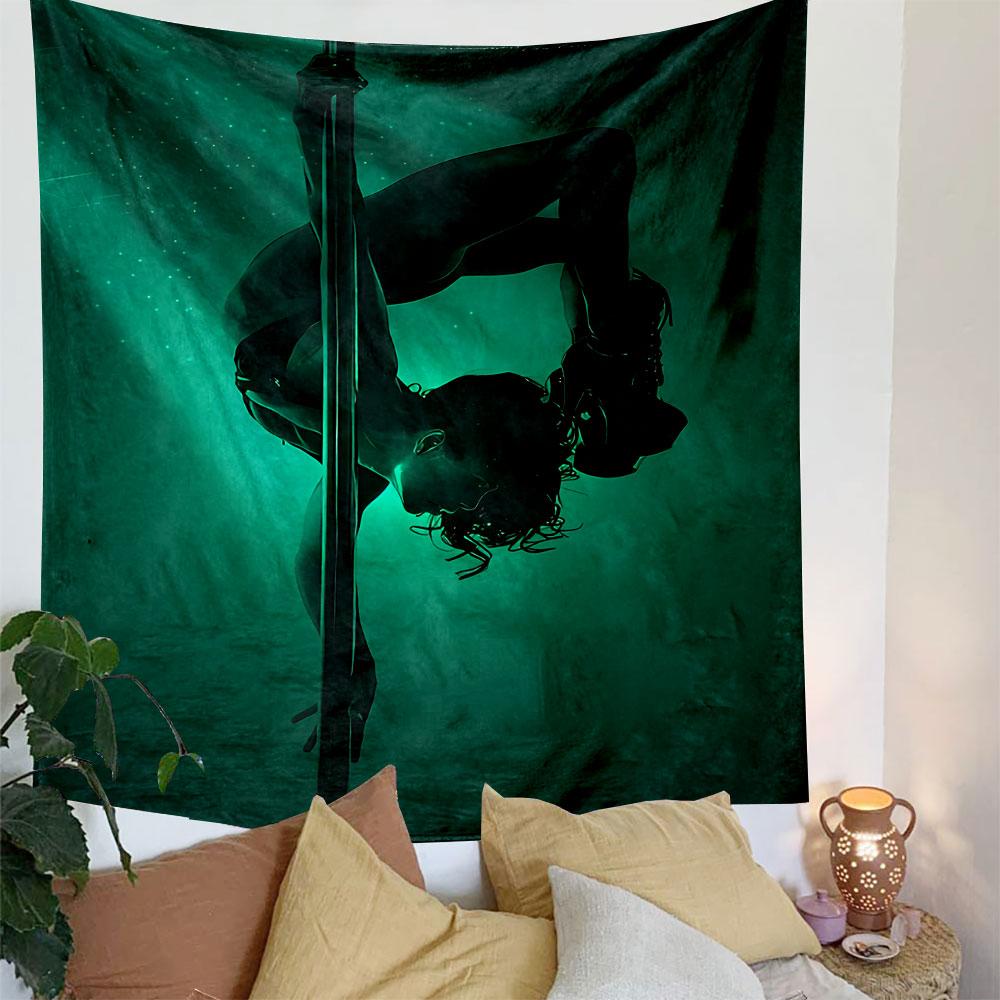 A silhouetted figure performing pole acrobatics under green lighting. Patterned tapestry for bedroom and living room home decor