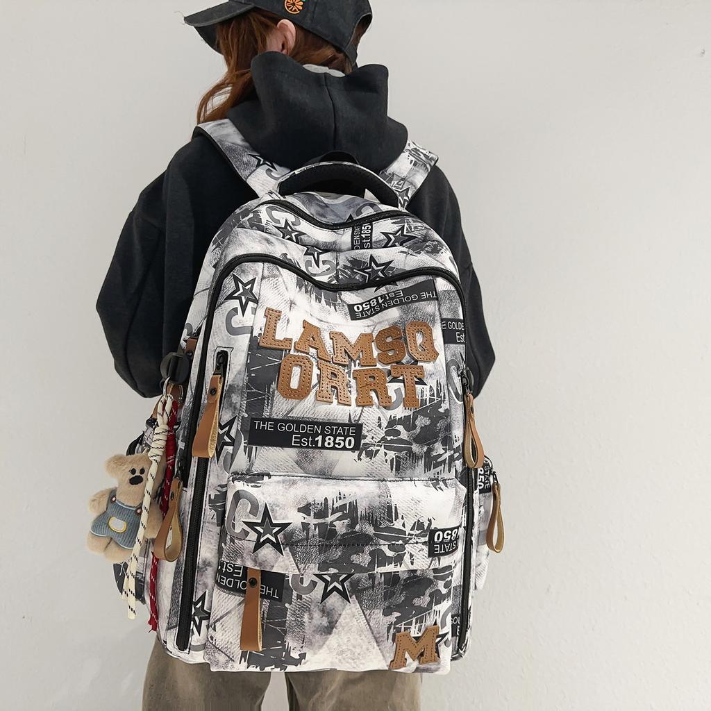 Schoolbag trendy cool graffiti new burden reduction schoolbag junior high school students large capacity backpack high value lightweight women's