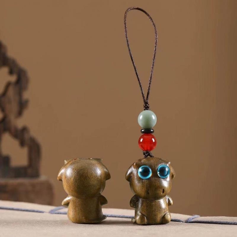Twelve Zodiac Animal Charms Green Sandalwood Set: Rat, Ox, Tiger, Rabbit, Dragon, Snake, Horse, Sheep, Monkey, Rooster, Dog, Pig.