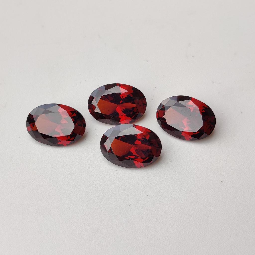 Партия россыпью цирконов, Натуральный циркон овальной огранки размером 14x10 мм, Целебная партия цирконов красного цвета.