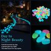 Outdoor glow-in-the-dark stones, decorative luminescent pebbles, suitable for landscaping and garden paths.