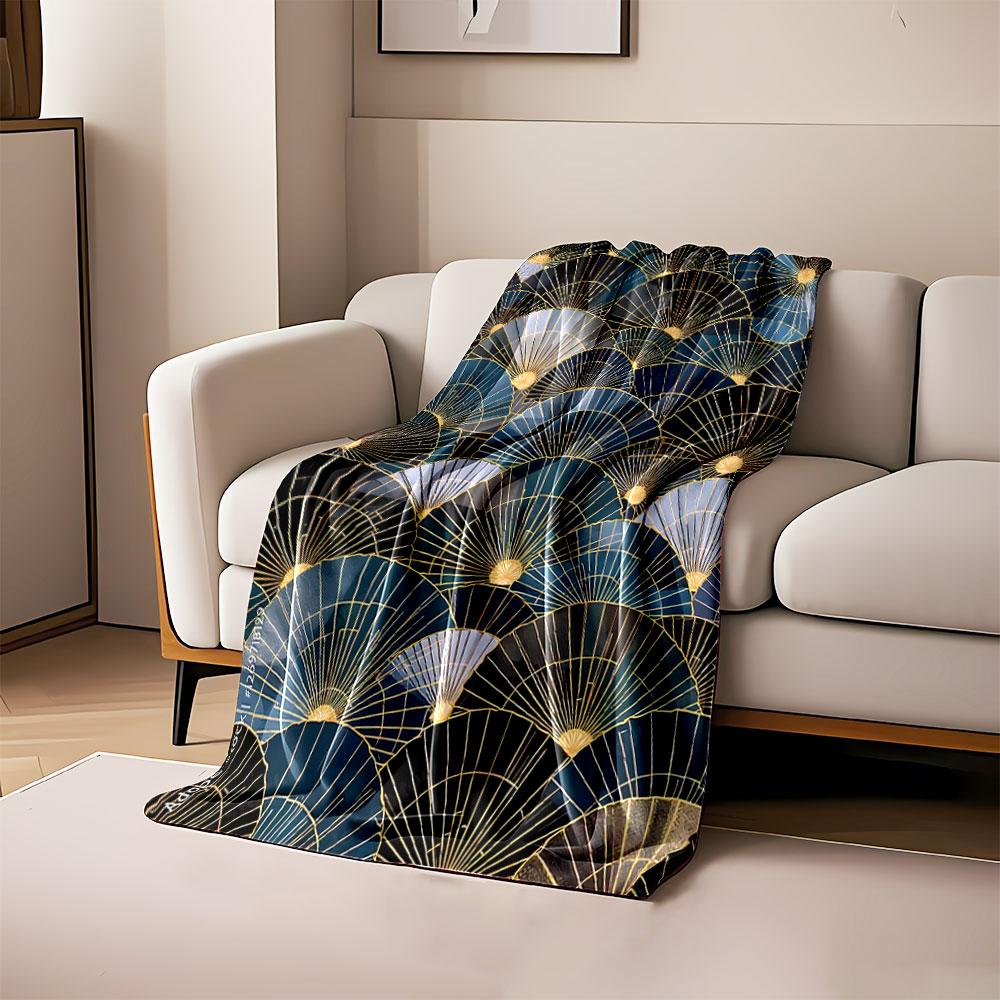 Overlapping fan shapes with gold lines and gradients of blue and black. for all seasons blanket lunch break throw gift