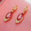 Трендовые золотые серьги с рубинами 2024 - Универсальный европейский и американский стиль для женщин