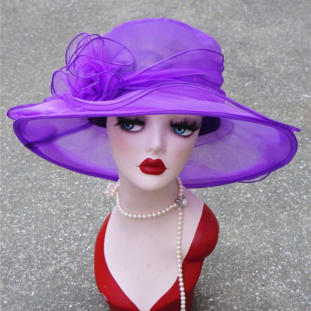 Широкополая солнцезащитная шляпка с декором в форме цветка. Материал-сетка.Цвета в ассортименте:розовый,белый,синий,фиолетовый,черный,жёлтый,красный.Размеры:глубина 10см,поля 11см,диаметр цветка 14см,окружность головы56-58см