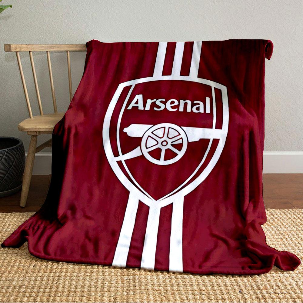 A white shield logo with a cannon design, set on a red background. for all seasons blanket lunch break throw gift