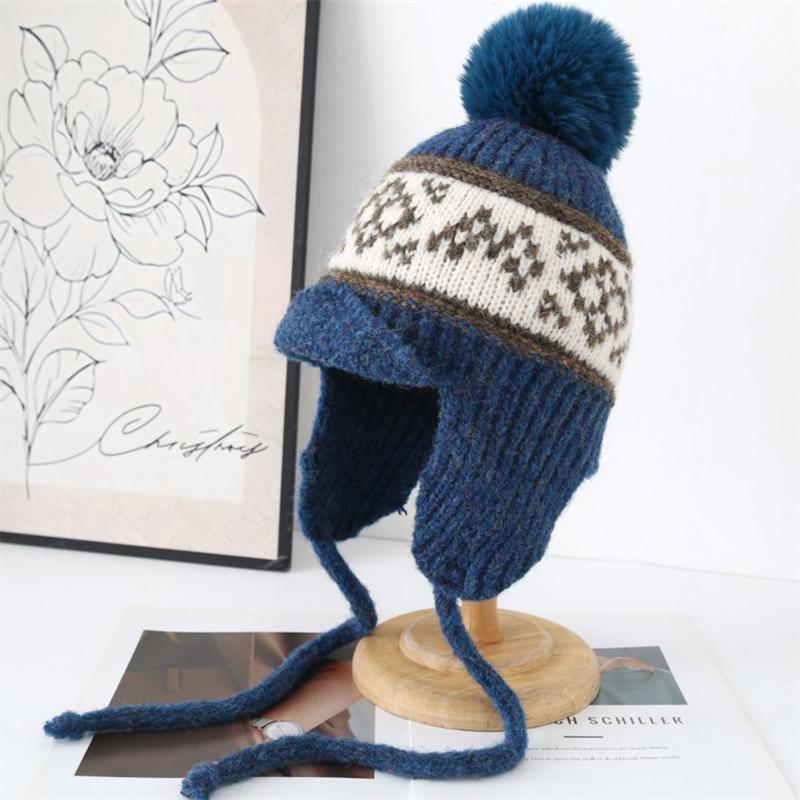 Autumn and winter warm knitted hat women's travel versatile bag head hat cold protection ear straps wool Lei Feng hat