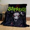 A demonic skull with horns, red eyes, black roses, and barbed wire. for all seasons blanket lunch break throw gift