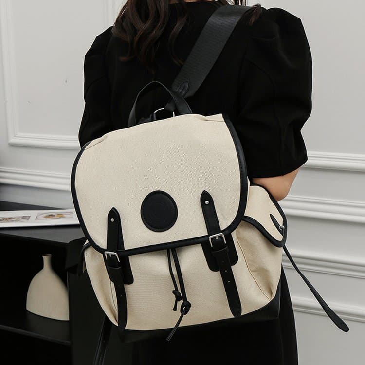 Color-blocked drawstring flip-top canvas commuter backpack