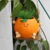 Creative Multifunctional Orange Swing Planter Pot With Swing Feature Suitable for Kids Entertainment and Home Gardening