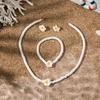 Bohemian vacation style egg flower necklace earrings set ins niche flower soft pottery color collarbone chain tide