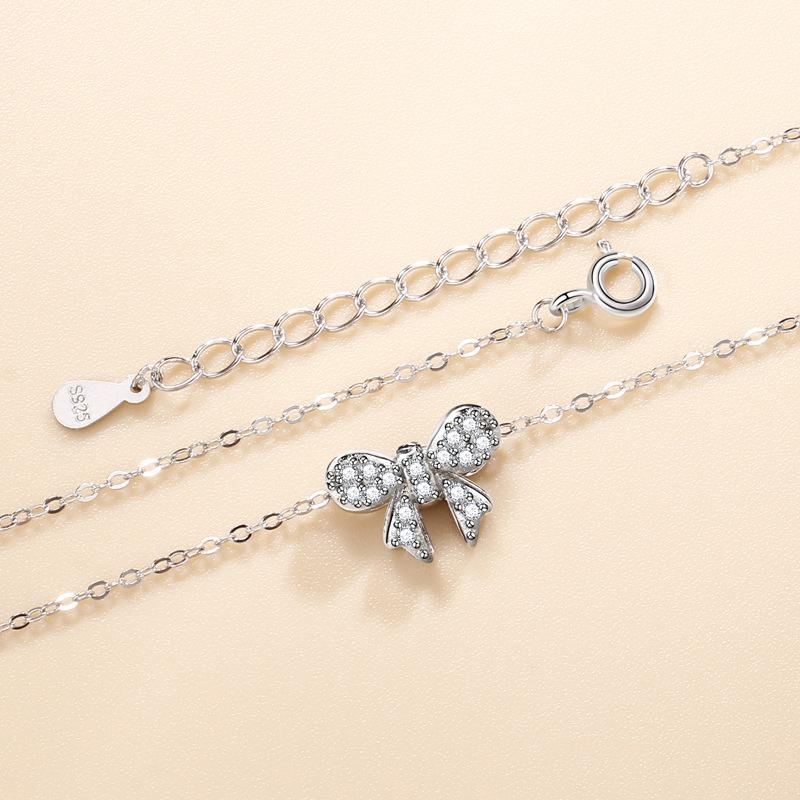 Ожерелье с бриллиантовым бантом для женщин, корейская версия, модный универсальный кулон, нишевый дизайн, стильные аксессуары