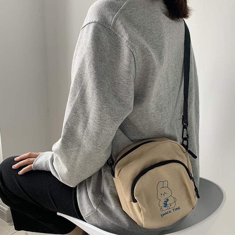 Милая маленькая сумка женская 2025 новая сумка через плечо сто с мультяжной холщовой сумкой