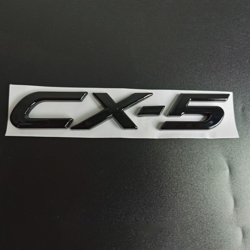 Glossy Black Numerical and Letter Badges for Mazda CX-30, CX-4, and CX-5 Trunk and Tail.