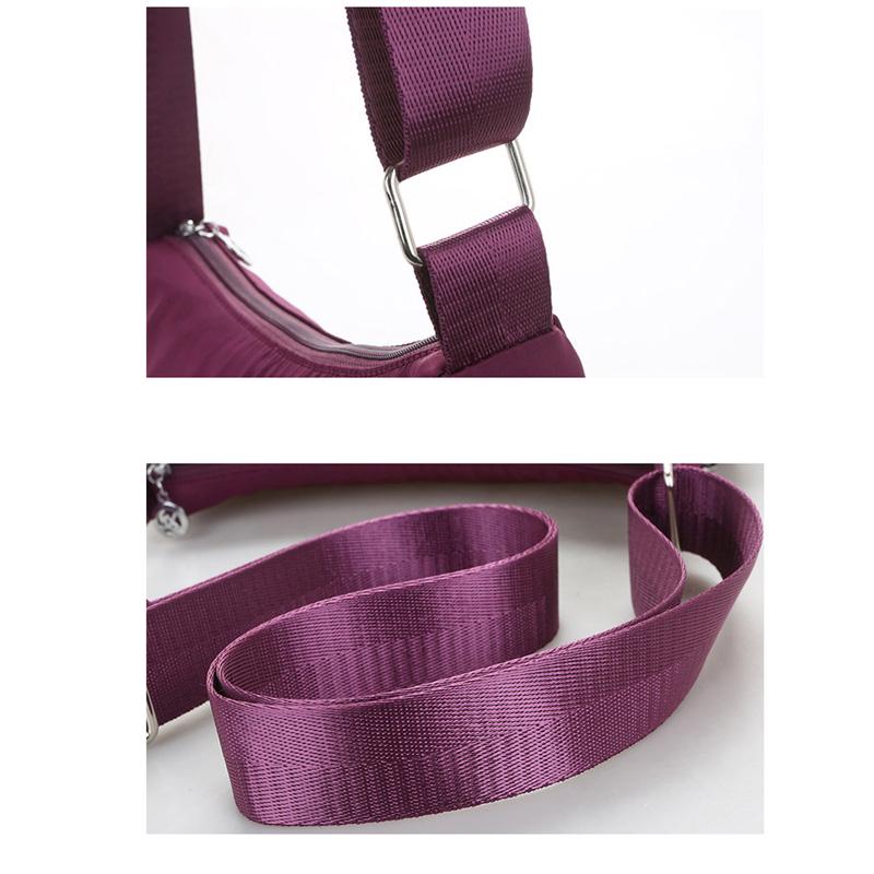 Женская нейлоновая сумка. Много карманов на молнии. Регулируемый ремешок через плечо