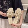 Xiaoxiangfeng flat-bottomed slippers women's outer wear 2025 summer new soft-bottomed fairy versatile pearl seaside sandals