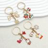 Elegant Christmas Keychain: Gold Snowflake & Snowman Pendant