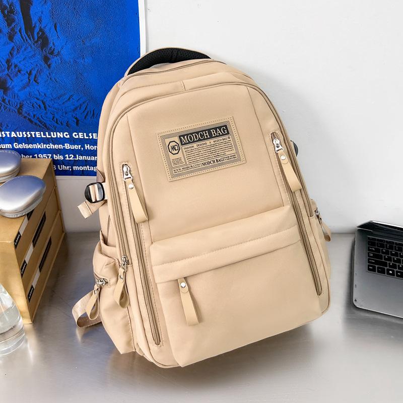 Schoolbag is specially designed for new schoolbags, female students, nylon retro simple, junior high school students, male large-capacity couple .