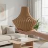 Brown decorative vase in the shape of pleats for flowers, elegant design