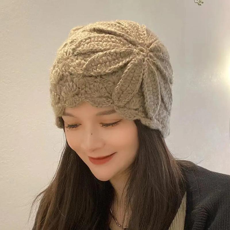 Autumn and winter fashion hollow knitted wool hat women's ear protection simple fashion big head circumference cold hat flower pullover hat