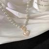 New super fairy temperament imitation pearl love necklace in Japan and South Korea, cold wind, sweet and simple OT buckle collarbone chain woman