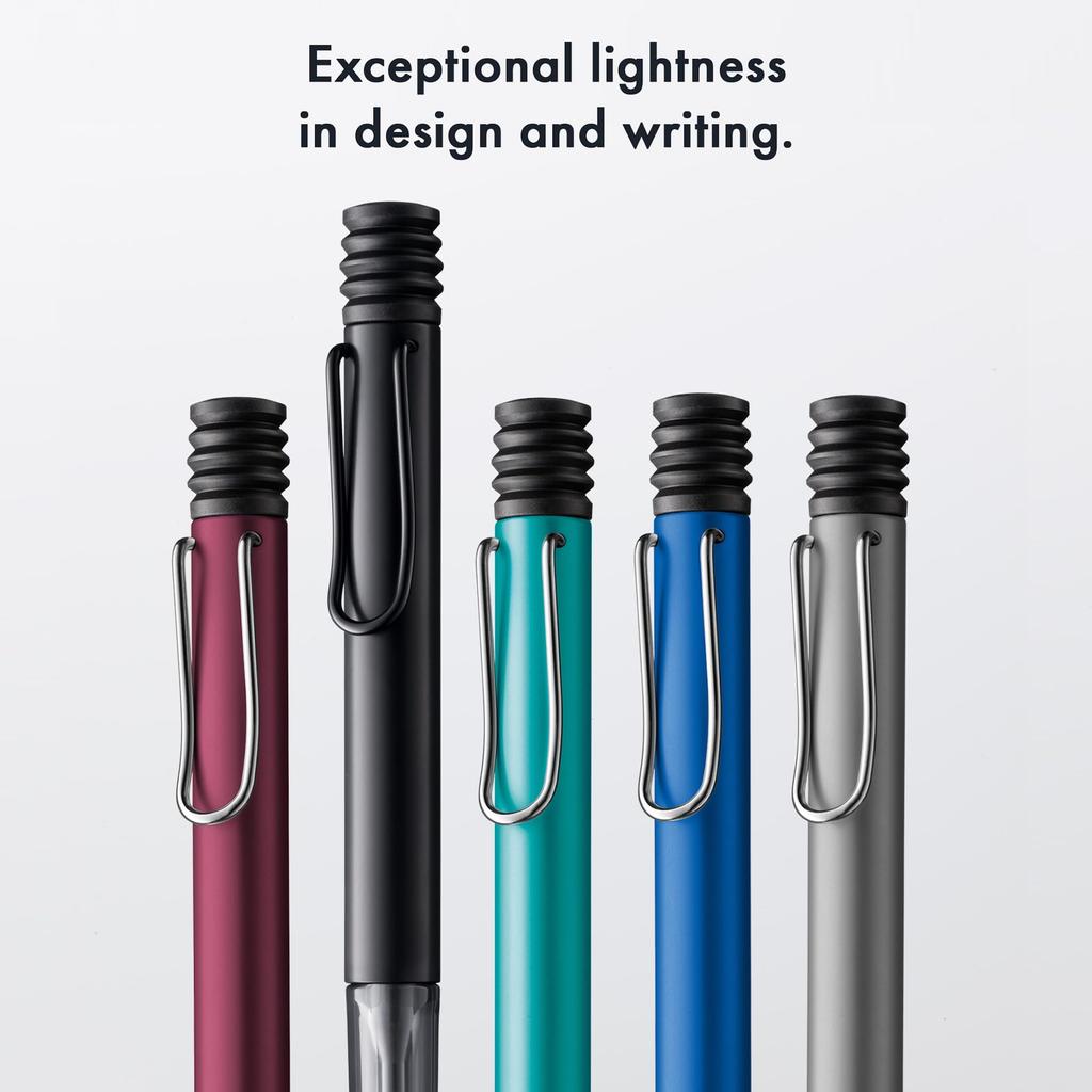 Lamy ballpoint ergonomic Medium Lightweight aluminum Includes refill M16 Al-Star (Autumn Pink) pen. Transparent, grip. nib. body. high-capacity