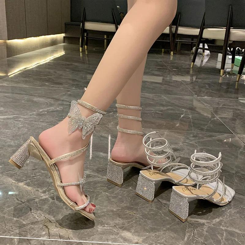 Модные женские сандалии на высоком каблуке Fairy, новинка 2024 года, летние сексуальные блестящие сандалии со стразами и змеей, тапочки, женская классная обувь
