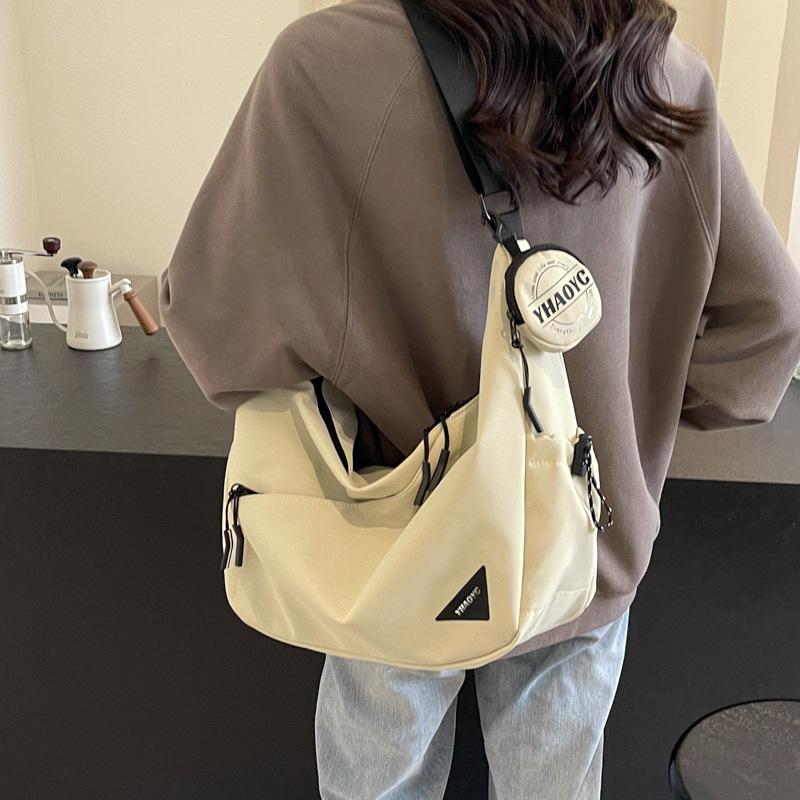 Large capacity canvas bag women 2026 new versatile casual simple dumpling bag feeling messenger bag