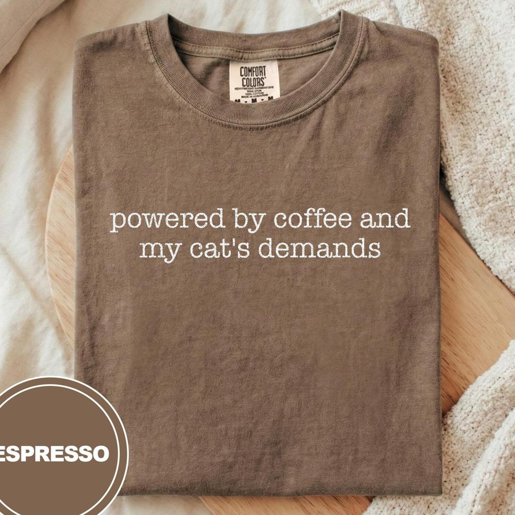 Powered By Coffee And My Cat's Demands T-Shirt and kids tshirt, Funny Cat Mom Gift, Coffee Lover Shirt and kids tshirt, Sarcastic Pet Owner Tee