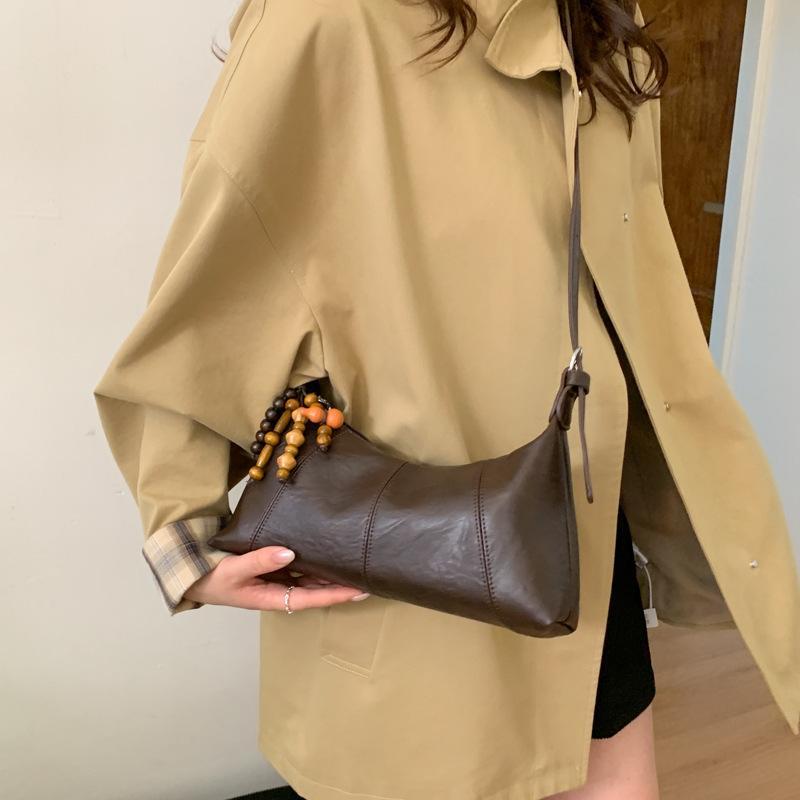 Сумка подмышку женская 2025 новая модная нишевый дизайн плечевая сумка женская популярная французская сумка-багет