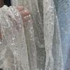 Embroidered sequin round patchwork net fabric suitable for wedding dresses formal gowns and designer clothing fabrics
